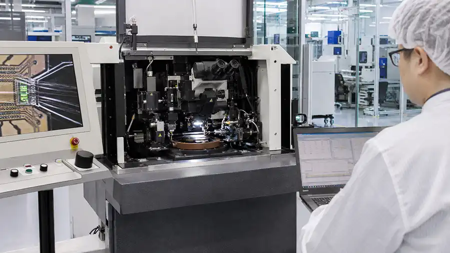 Factory acceptance test review of an ASM AERO wire bonding machine with engineer monitoring bond performance Factory acceptance test review of an ASM AERO wire bonding machine with engineer monitoring bond performance